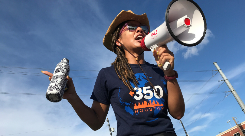 Shelly Baker using a megaphone while organizing for 350 Action.